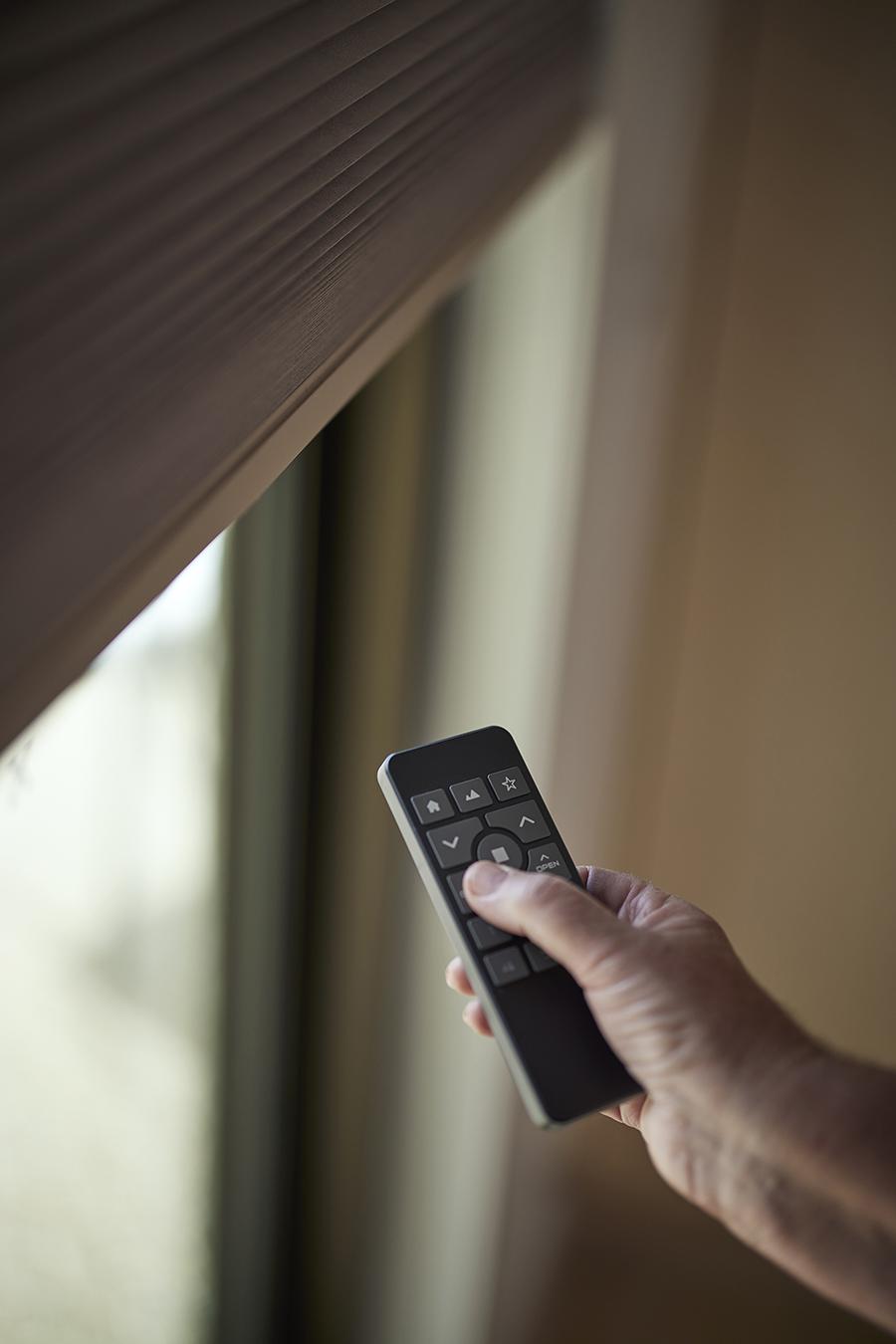A remote control resting on a side table