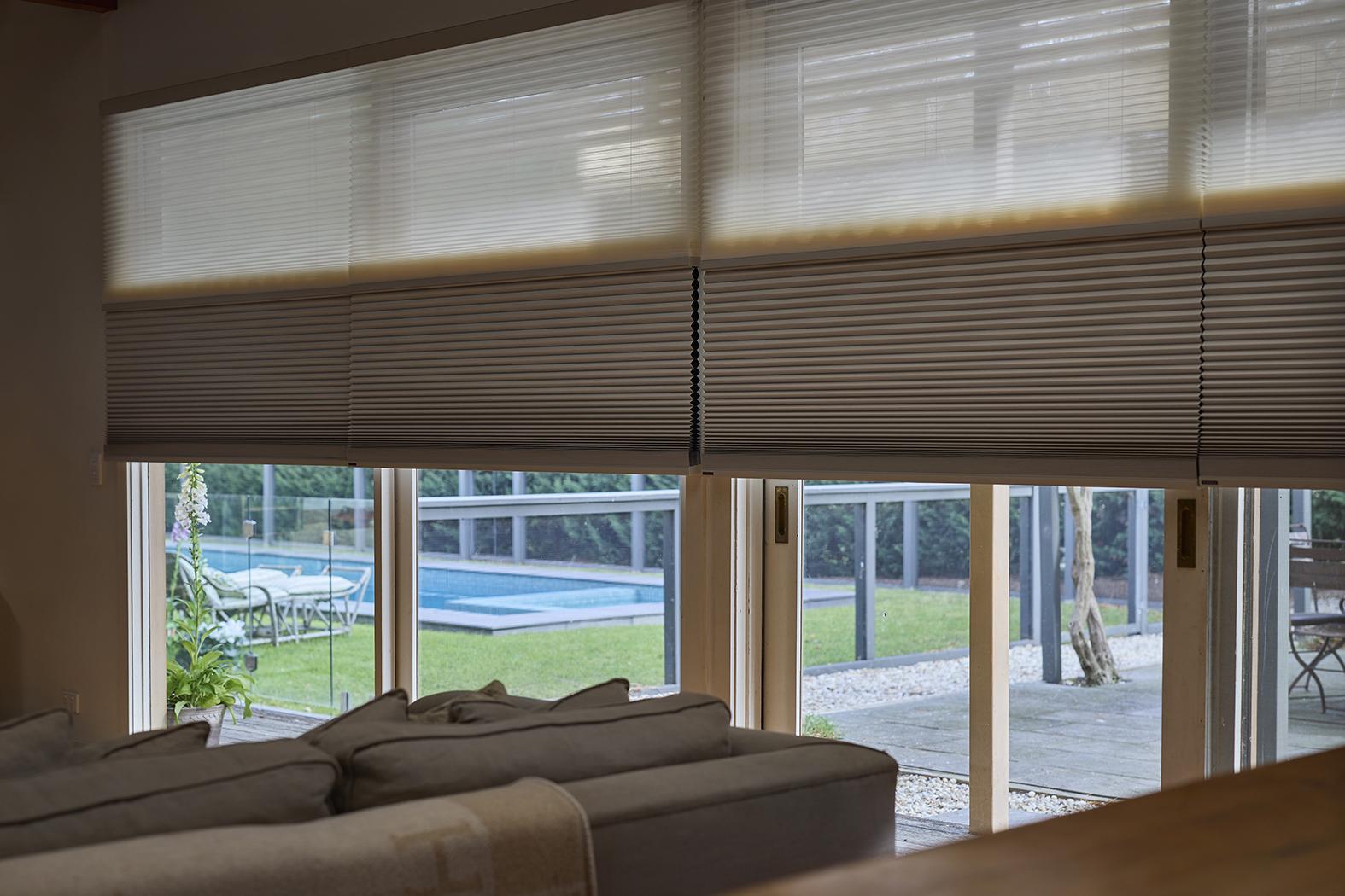 Two fabrics in one headrail, sheer by day and dark by night