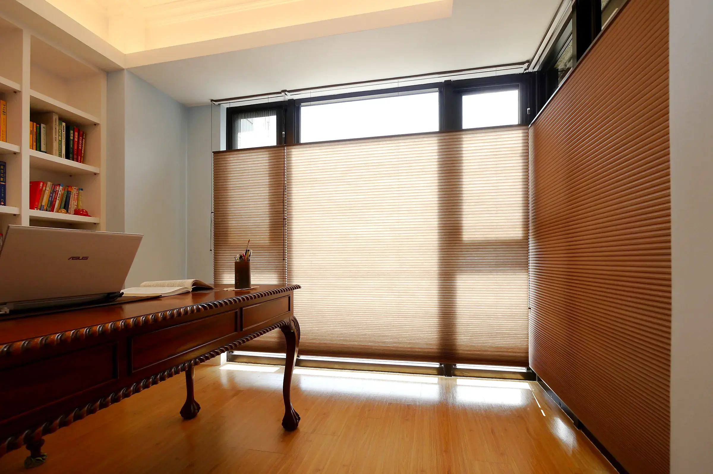 A honeycomb shade part raised from the bottom and lowered from the top