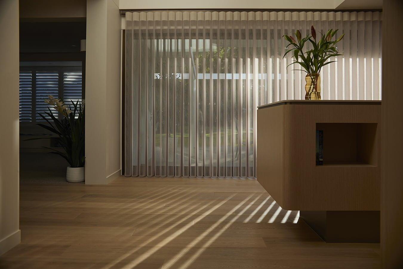 SmartDrape sheer vanes across a wide living-room window