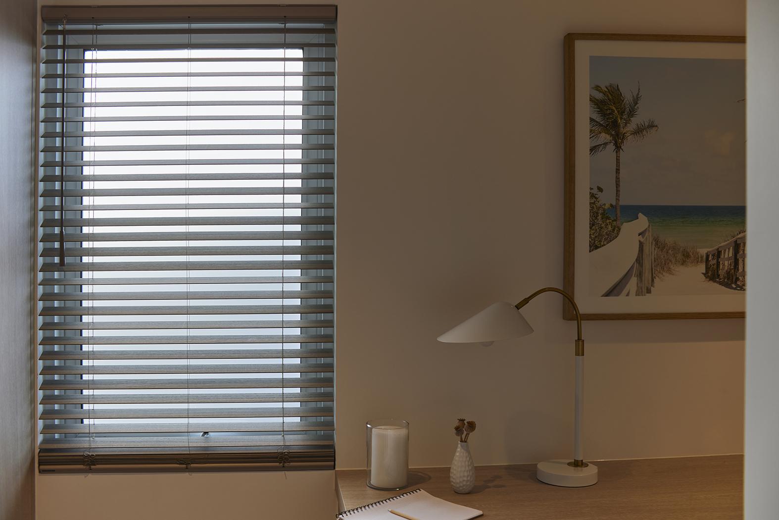 An office window with an open blind.