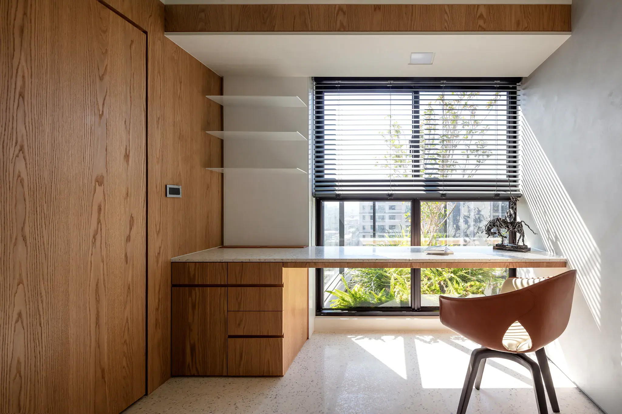 A calm bedroom with the blinds lowered